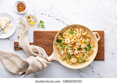 Shrimp And Zucchini Noodles Or Zoodles Pasta With Parmesan And Chili Flakes Cooked In A Cast Iron Pan