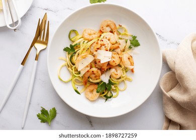 Shrimp And Zucchini Noodles Or Zoodles Pasta With Parmesan And Chili Flakes Plated In White Pasta Bowls