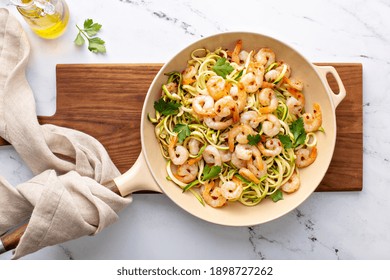 Shrimp And Zucchini Noodles Or Zoodles Pasta With Parmesan And Chili Flakes Cooked In A Cast Iron Pan