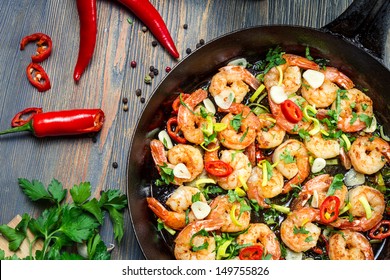 Shrimps Fried On Pan With Fresh Herbs