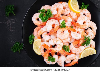 Shrimps, Prawns On Black Plate. Boiled Shrimps, Prawns. Seafood. Top View, Overhead