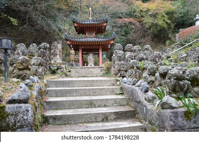A shrine in autumn Japan. A lot of Buddhist images are deified. The letter with 色即是空 on stone boad means everything in the world has no reality.

