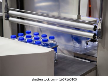 Shrink Film Wrapping Machine For Bottle Of Water. Food Industry