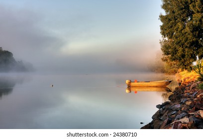 Shrouded By Mist A Secured Boat On The Bellinger River At Dawn