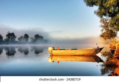 Shrouded By Mist A Secured Boat On The Bellinger River At Dawn