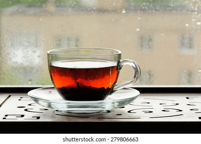 Shu Puerh Tea Brewed In Glass Cup On Window Sill