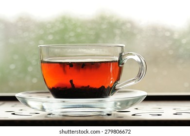 Shu Puerh Tea Brewed In Glass Cup On Window Sill