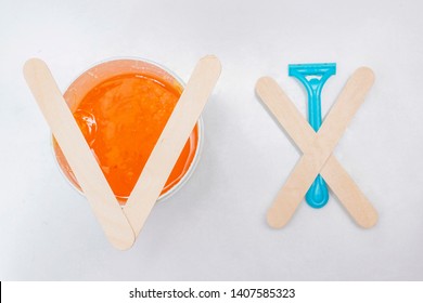 Shugaring Sugar Depilation Is Yes Discard The Razor. On The Razor Are Sticks In The Form Of A Cross On Sugar Paste Sticks Lie In The Form Of A Tick