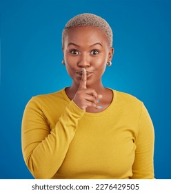 Shush, secret and portrait of black woman in studio for secret, announcement and news. Silence, mystery and privacy with female isolated on blue background for rumor, gossip and confidential - Shutterstock ID 2276429505