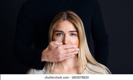 Shut Up And Listen. Male Hand Closes Woman Mouth And Prevents Her From Talking About Feelings And Domestic Violence,panorama, Copy Space