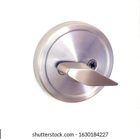 Shut Off Door With A Round Pocket Door Lock On A White Door