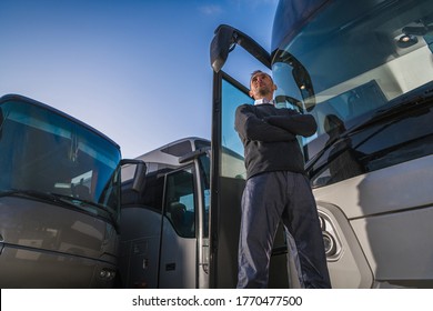 Shuttle Buses Transportation Business Owner In Front Of His Fleet Of Coach Buses. Caucasian Transportation Industry Company President In His 40s.