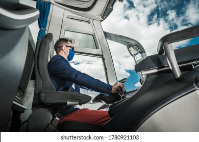Shuttle Coach Bus Driver Inside the Modern Vehicle. Long Haul Road Trip Travels. Caucasian Driver.