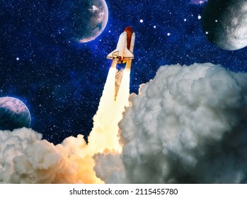 Shuttle launch in the clouds to outer space. Dark space with stars on background.Spaceship flight. Elements of this image furnished by NASA - Powered by Shutterstock - Get 15% off with code: PIKWIZARD15