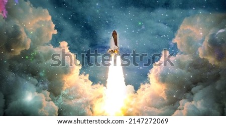 Shuttle launch in the clouds to outer space. Dark space with stars on background.Spaceship flight. Elements of this image furnished by NASA