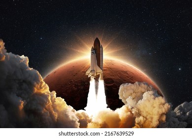 Shuttle rocket successfully takes off into space on a background of the red planet Mars with the sunrise. Spaceship with clouds of smoke and blast liftoff into stellar sky. Concept of space travel 