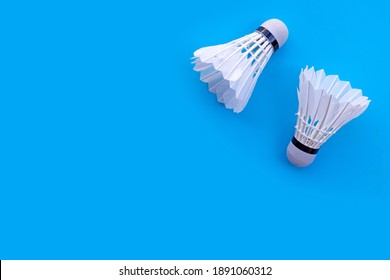 Shuttlecock Or Badminton Balls On Blue Background.