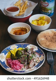 Shwarma On A Plate, Hummus, Pita And Pickles On A Background, Cafe In Israel