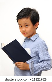 Shy Asian Boy Reading A Book