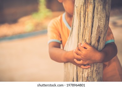 Shy Child He Is Standing Behind The Pillars.