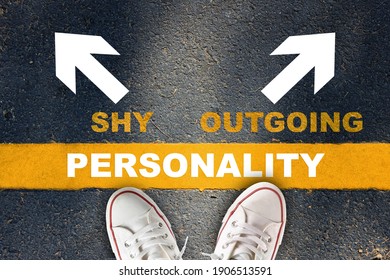 Shy or outgoing person concept and understanding relationship in your life idea. Personality written on yellow line with shy and outgoing with white arrow on asphalt road