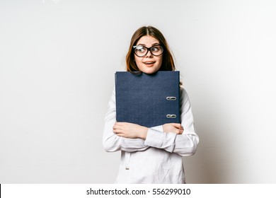 Shy Schoolgirl.First Job Day.Office Worker Made Mistake.Woman With Mock Up Folder.Crossed Arms Holds Folder.Teenager Shy