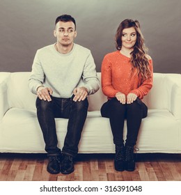 Shy Woman And Man Sitting On Sofa Couch. First Date. Attractive Girl And Handsome Guy Meeting Dating And Trying To Talk. Instagram Filtered.