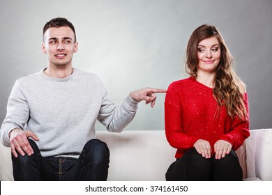 Shy Woman And Man Sitting On Sofa Couch Next Each Other. First Date. Attractive Girl And Handsome Guy Meeting Dating And Trying To Talk. Male Touching Picking Up Female.