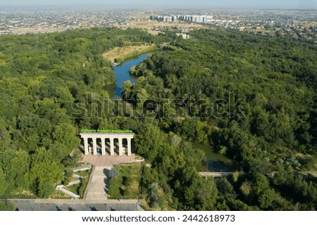 Shymkent city, Kazakhstan. 14 October 2020 - Aerial view of Dendrological park. Translation of the green sign on the arch: 
