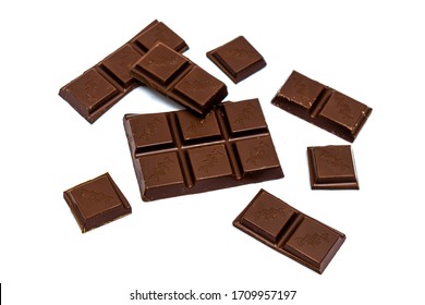 Shymkent, Kazakhstan - April 17, 2020; Slices Of Milk Chocolate Isolated On A White Background With A Top View With The Inscription In Russian 