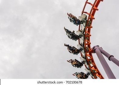 Siam Park City, Bangkok, Thailand - August 20, 2017: People Ride Roller Coaster, Legs Swinging Back And Forth As Gravity.