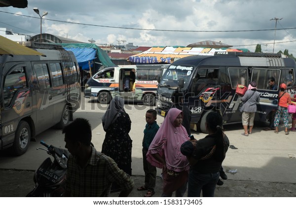 Siantar, North Sumatera-June 2019: Many\
families prepare to travel to hometown, called mudik, at Terminal\
Parluasan. Mudik is a tradition for Indonesian to go back to home\
town on big holidays.