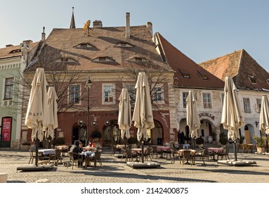 SIBIU, ROMANIA - March 2022: Traditional cafe in the old town of Sibiu in Romania