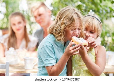 Sibling Couple Sharing A Delicious Piece Of Cake Full Of Enjoyment