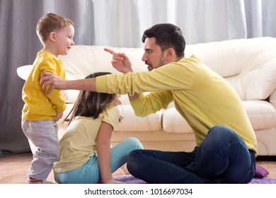 Sibling Relationship. Quarrels Of The Brother And Sister. Jealousy In The Family. Older Child. The Father Scolds The Child. The Jealousy Of The Youngest Child. The Parents Pay Little Attention To The 