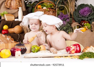 Siblings cooking in chef's hats