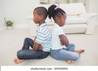 Siblings Not Talking To Each Other At Home In The Living Room