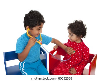 Siblings Posing as Doctor and Patient Indulging in Pretend Play, Isolated, White
