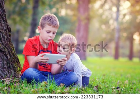 Siblings using a tablet 