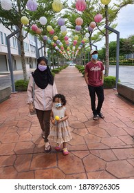 Siblings Are Wearing Face Mask In Public Area As Government Will Fine Anyone Who Did Not Wearing It. Selangor, Malaysia. 19th Dec 2020.