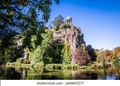 Sibyl temple and lake in Buttes-Chaumont Park, Paris, France - Shutterstock ID 1640637277