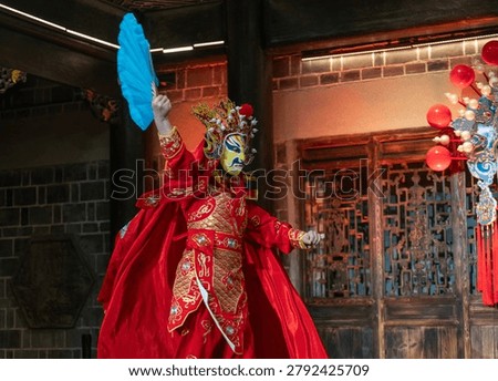 Sichuan Opera Face Changing Performer on Traditional Theater Stage