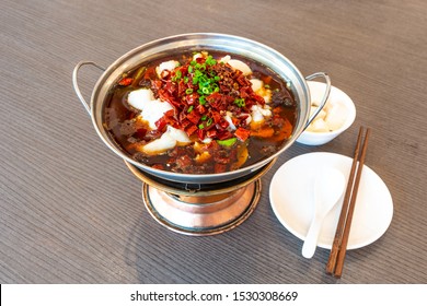 Sichuan Spicy Boiled Fish Hot Pot With Red Hot Spicy Chilli. Asia China Chongqing Chengdu Food.