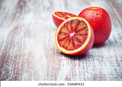 Sicilian orange isolated on a wood background