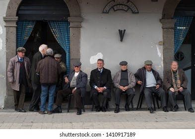 Sicily, Italy April 10 2017 Old Italian Men Are Sitting Near The Street Cafe