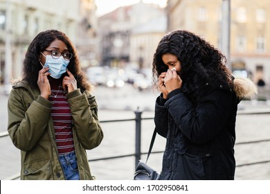 Sick African Girl With Sneezing At City Street, Woman Without Protective Mask While Spreading Flu,cold, Covid-19 Or Coronavirus, Bad Etiquette, Manners For Cough, Sneeze Should Cover The Mask.