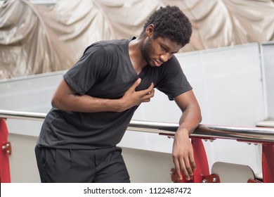 Sick African Man With Heart Attack Or Chest Pain; Portrait Of African Man Suffering From Heart Attack, Chest Pain, Health Care Concept; Young Adult African Man Or Black Man Model