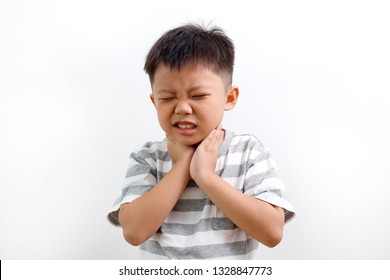 Sick Asian Kid Touching His Painful Neck, Sore Throat And Flu, Throat Infection. Isolated On White Background.