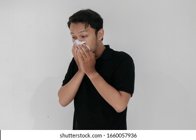 Sick Asian Man Flu And Cough Is Sitting With Using Tissue. Illness, Influenza, Pain Concept. Healthcare And Corona Concepts.