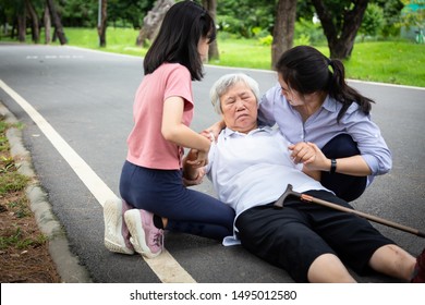 Sick Asian Senior Mother With Heat Stroke,high Temperature,vertigo On Floor After Falling Down,daughter,granddaughter To Help,take Care Of Elderly Fell Faint,exhausted,suffering From Illness,sunburn 